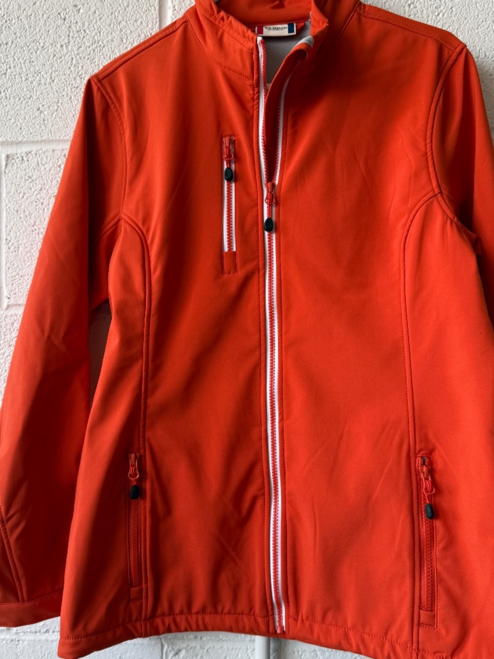Clique women’s orange soft shell NWOT .